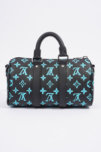 LOUIS VUITTON KEEPALL BANDOULIERE BLACK AND BLUE MONOGRAM COATED CANVAS 25CM